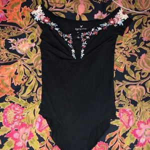 Embroidered body suit. Size SMALL